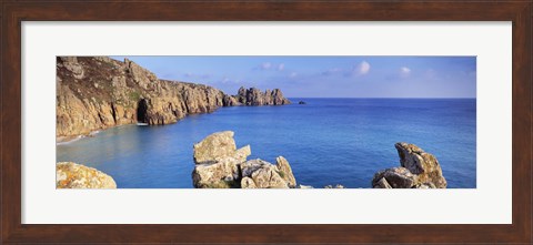 Framed Rock formations at seaside, Logan rock, Porthcurno Bay, Cornwall, England Print