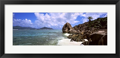 Framed Rock formations on the beach on Anse Source d&#39;Argent beach with Praslin Island in the background, La Digue Island, Seychelles Print