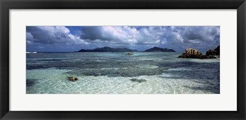 Framed Snorkeler in the clean waters on Anse Source d&#39;Argent beach, La Digue Island, Seychelles Print