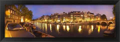 Framed Night view along canal, Amsterdam, Netherlands Print