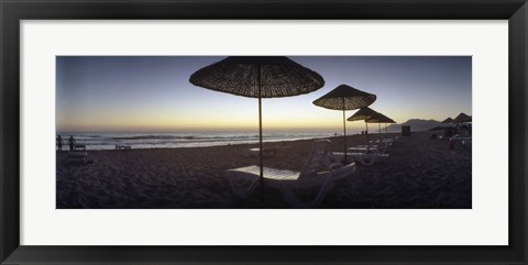 Framed Beach chairs and straw sun umbrellas on Patara Beach on the Mediterranean Sea at sunset, Patara, Antalya Province, Turkey Print