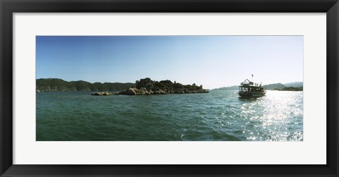 Framed Rocky island and boat in the Mediterranean sea, Sunken City, Kekova, Antalya Province, Turkey Print