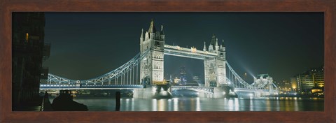 Framed Low angle view of a bridge lit up at night, Tower Bridge, London, England Print