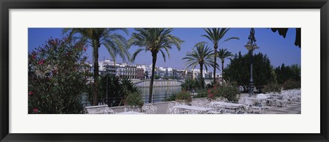 Framed Sidewalk cafe at the riverside, Guadalquivir River, Seville, Spain Print