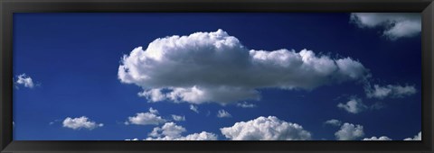 Framed Fluffy clouds in blue sky Print