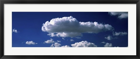 Framed Fluffy clouds in blue sky Print