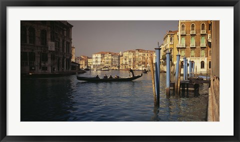 Framed Tourists sitting in a gondola, Grand Canal, Venice, Italy Print