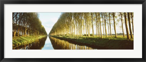 Framed Belgium, tree lined waterway through countryside Print