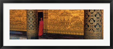 Framed Monk in prayer hall at Wat Mai Buddhist Monastery, Luang Prabang, Laos Print