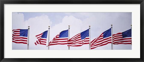 Framed Low angle view of American flags fluttering in wind Print