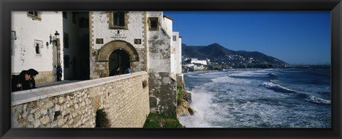 Framed Tourists in a church beside the sea, Sitges, Spain Print