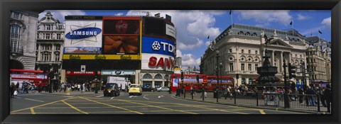 Framed Commercial signs on buildings, Piccadilly Circus, London, England Print