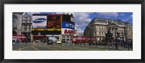 Framed Commercial signs on buildings, Piccadilly Circus, London, England Print