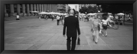 Framed Rear view of a businessman walking on the street, Stuttgart, Germany Print