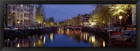 Framed Night View Along Canal Amsterdam The Netherlands Print