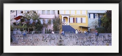 Framed Low Angle View Of A Group Of People Sitting On A Wall, Tubingen, Baden-Wurttemberg, Germany Print