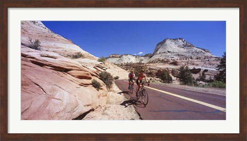 Framed Two people cycling on the road, Zion National Park, Utah, USA Print