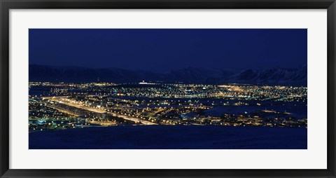 Framed High angle view of city lit up at night, Reykjavik, Iceland Print