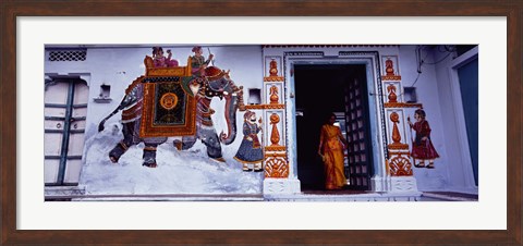 Framed Young woman standing at the door, Udaipur, Rajasthan, India Print