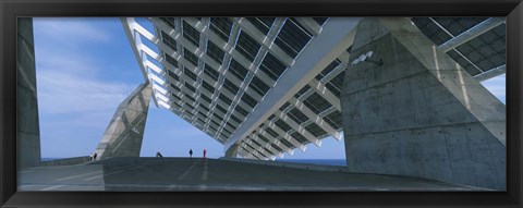 Framed Four people under a structure, Barcelona, Catalonia, Spain Print