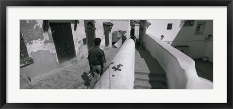 Framed Rear view of a man walking in front of a building, Casaba, Algiers, Algeria Print