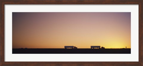 Framed Silhouette of two trucks moving on a highway, Interstate 5, California, USA Print