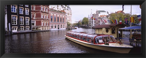 Framed Tourboat in a channel, Amsterdam, Netherlands Print