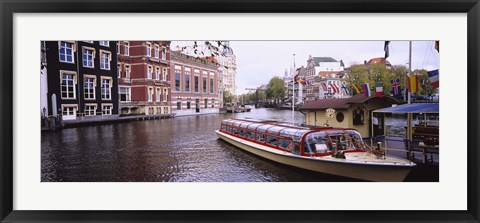 Framed Tourboat in a channel, Amsterdam, Netherlands Print