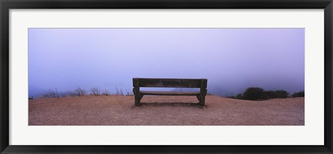 Framed Empty bench in a parking lot, California, USA Print