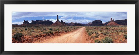 Framed Dirt road through desert landscape with sandstone formations, Utah. Print