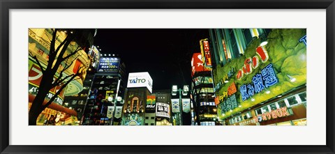 Framed Low angle view of buildings lit up at night, Shinjuku Ward, Tokyo Prefecture, Kanto Region, Japan Print