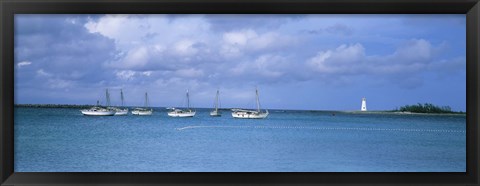 Framed Boats in the sea with a lighthouse in the background, Nassau Harbour Lighthouse, Nassau, Bahamas Print