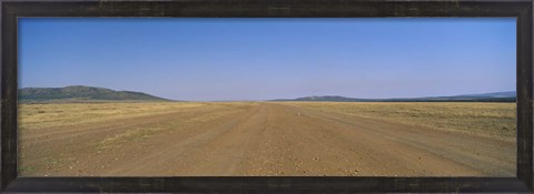 Framed Dirt road passing through a landscape, Masai Mara National Reserve, Great Rift Valley, Kenya Print