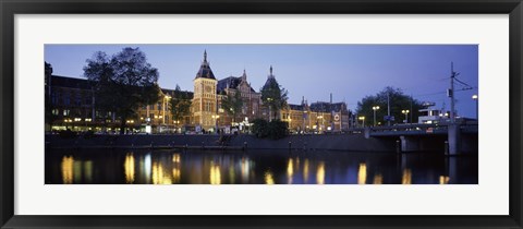 Framed Reflection of a railway station in water, Amsterdam Central Station, Amsterdam, Netherlands Print