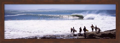 Framed Silhouette of surfers standing on the beach, Australia Print