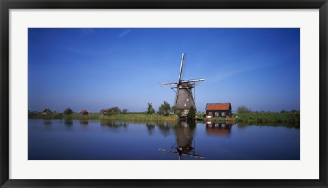 Framed Reflection of a traditional windmill in a lake, Netherlands Print