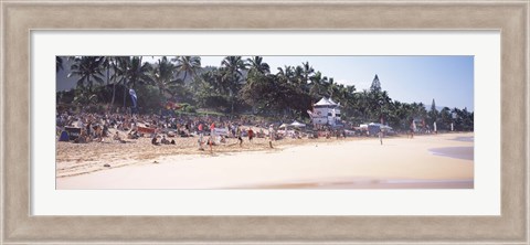 Framed Tourists on the beach, North Shore, Oahu, Hawaii, USA Print