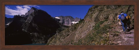Framed Hikers hiking on a mountain, US Glacier National Park, Montana, USA Print
