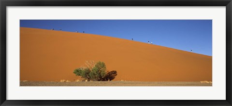 Framed Tourists climbing up a sand dune, Dune 45, Sossusvlei, Namib Desert, Namibia Print