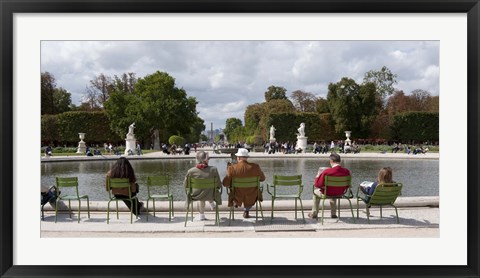 Framed Tourists sitting in chairs, Jardin de Tuileries, Paris, Ile-de-France, France Print