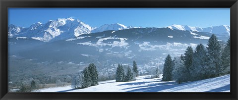 Framed Trees with snow covered mountains in winter, Combloux, Mont Blanc Massif, Haute-Savoie, Rhone-Alpes, France Print