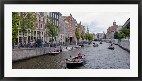 Framed Tourboats in a canal, Amsterdam, Netherlands Print