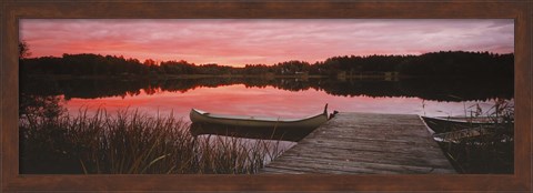 Framed Canoe tied to dock on a small lake at sunset, Sweden Print