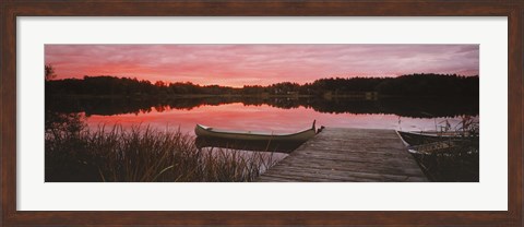 Framed Canoe tied to dock on a small lake at sunset, Sweden Print