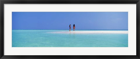 Framed Two women standing on the beach sandbar, Maayafushi Island, Ari Atoll, Maldives Print