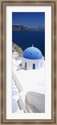 Framed High angle view of a church with blue dome, Oia, Santorini, Cyclades Islands, Greece Print