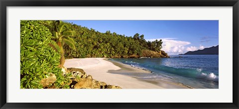 Framed Waves breaking on a small secluded beach on North Island, Seychelles Print