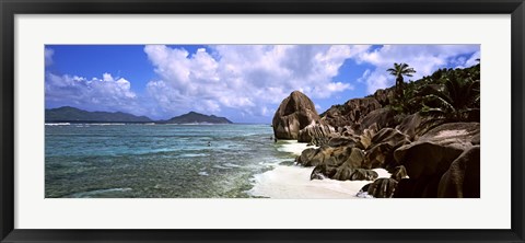 Framed Rock formations on the beach on Anse Source d&#39;Argent beach with Praslin Island in the background, La Digue Island, Seychelles Print