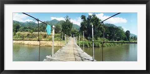 Framed Old wooden bridge across the river, Chiang Mai Province, Thailand Print