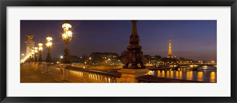 Framed Bridge across the river lit up at dusk, Pont Alexandre III, Seine River, Paris, Ile-De-France, France Print